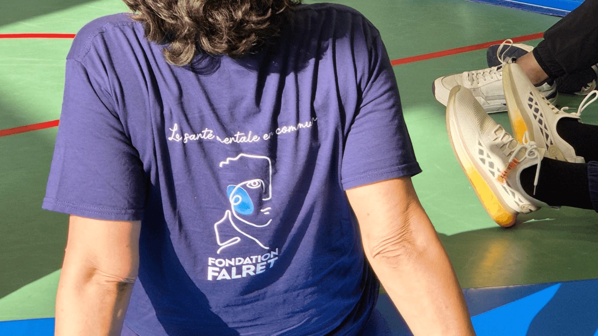 person in black long sleeve shirt holding babys feet