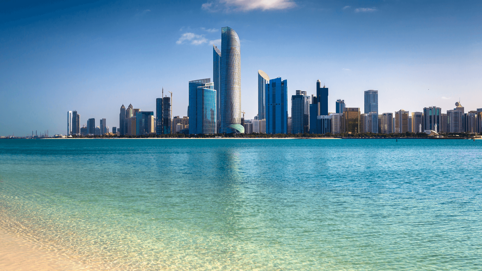View of Abu Dhabi skyline with modern skyscrapers reflected on the water | Lunasole Hospitality