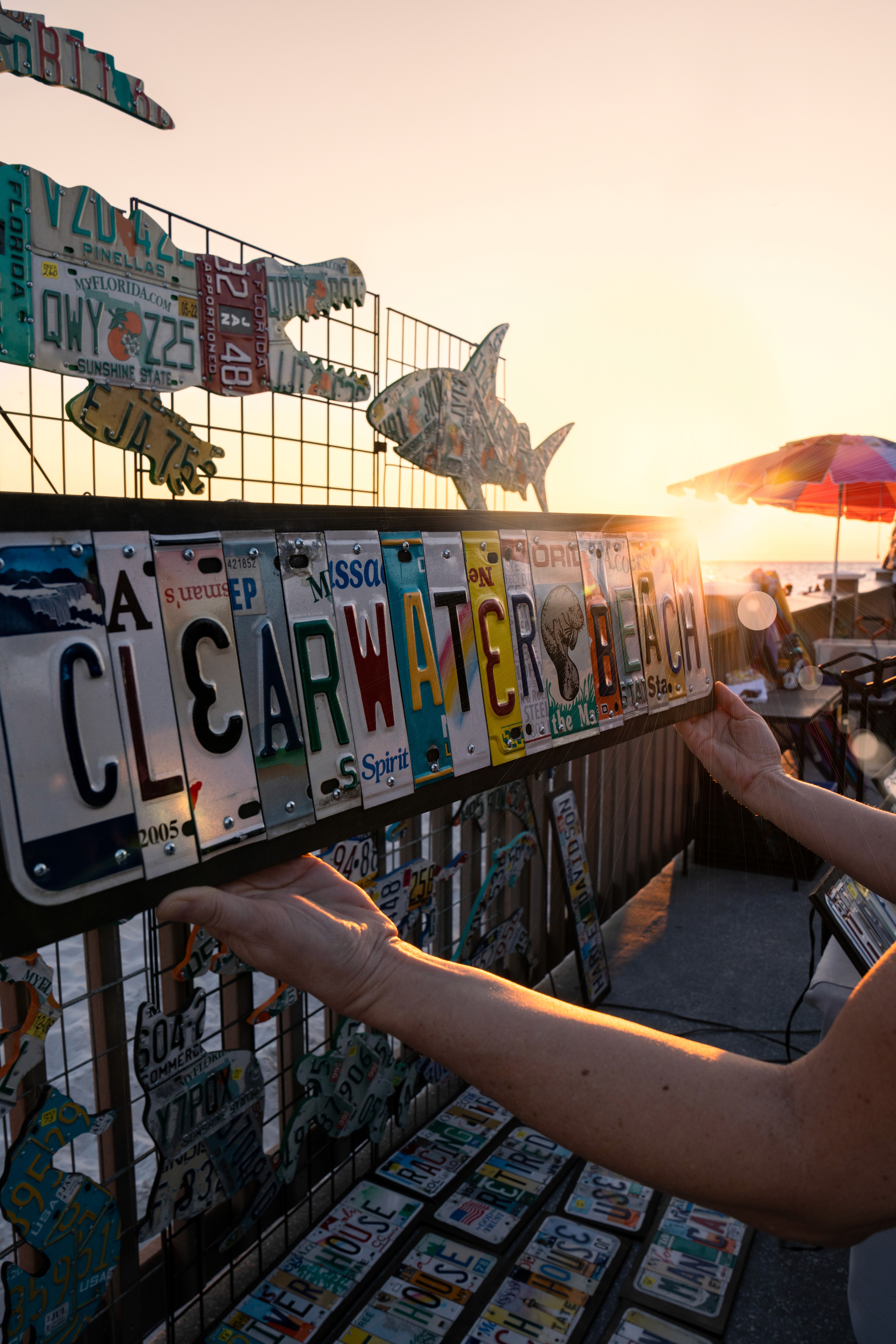  A handmade sign composed of vintage license plates spelling out Clearwater Beach at Pier 60