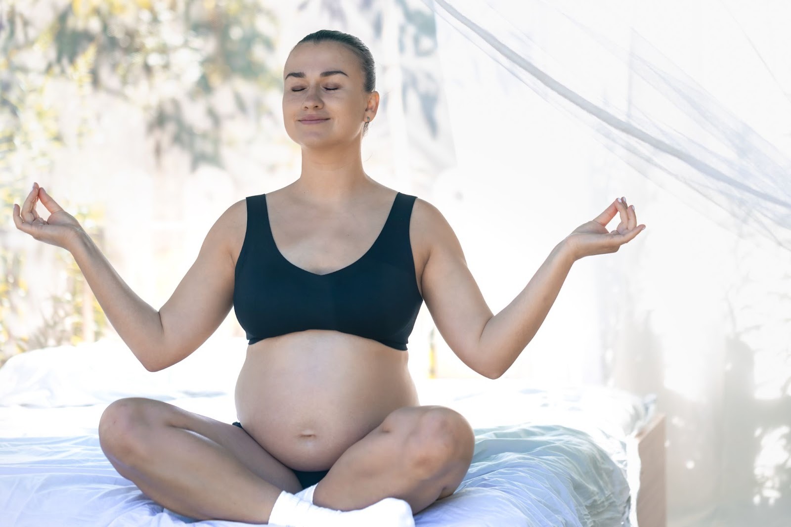 Pregnant woman practicing counted breathing exercise