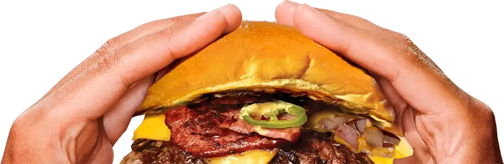 Hands holding a Bunz of Steel smash burger
