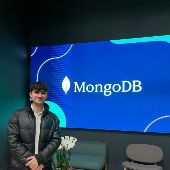 two people looking at a tablet and smiling