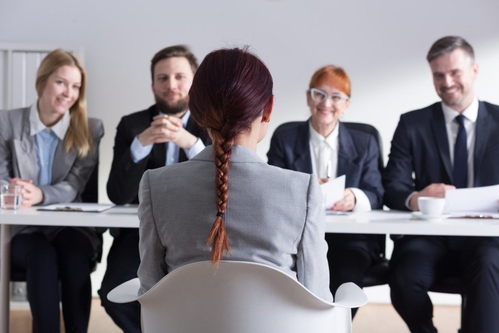 Person in a professional setting conducting a job interview.