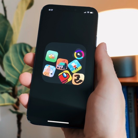 A photo of a phone with 7 app icons bouncing around and colliding