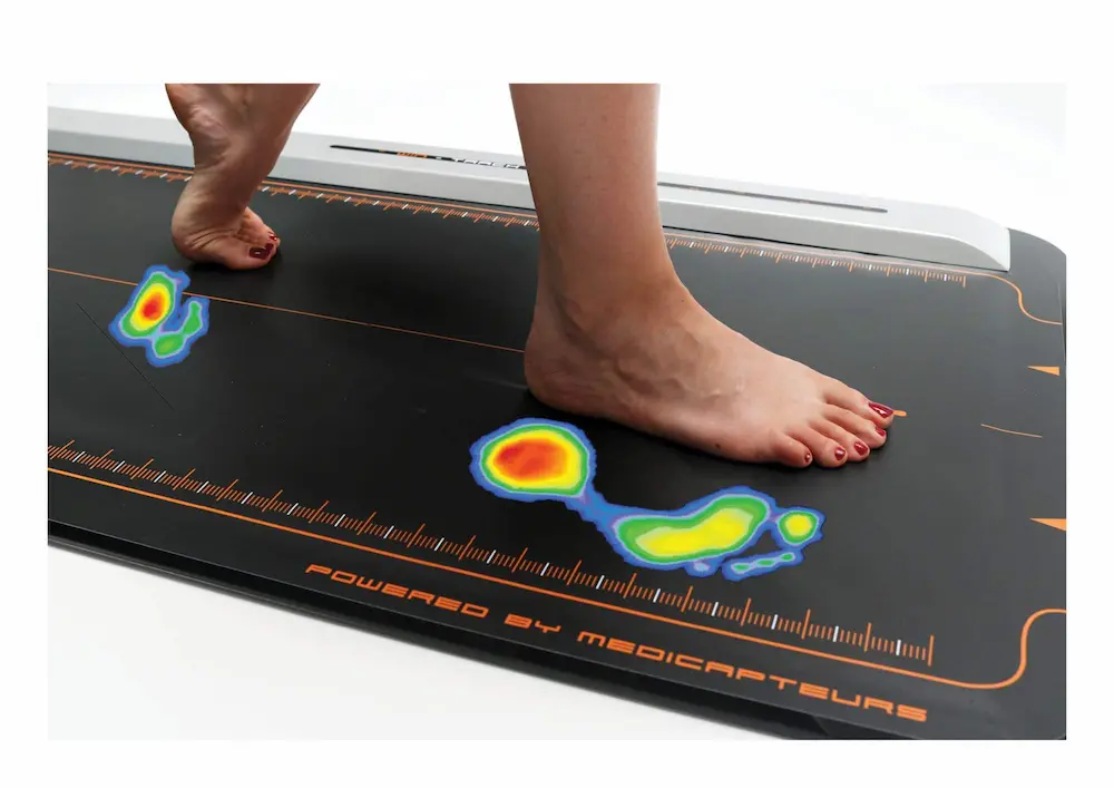 a woman getting tested on a pressure plate