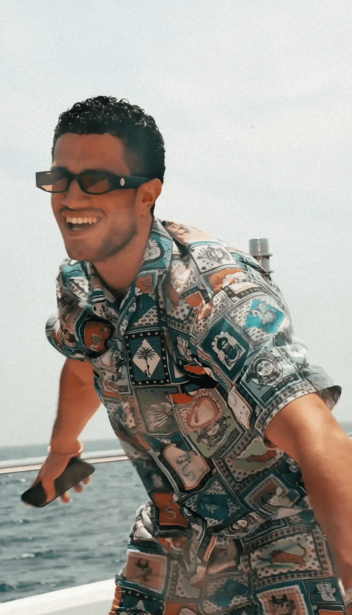 Bride and groom walking on street at night