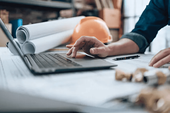 black laptop computer on white table