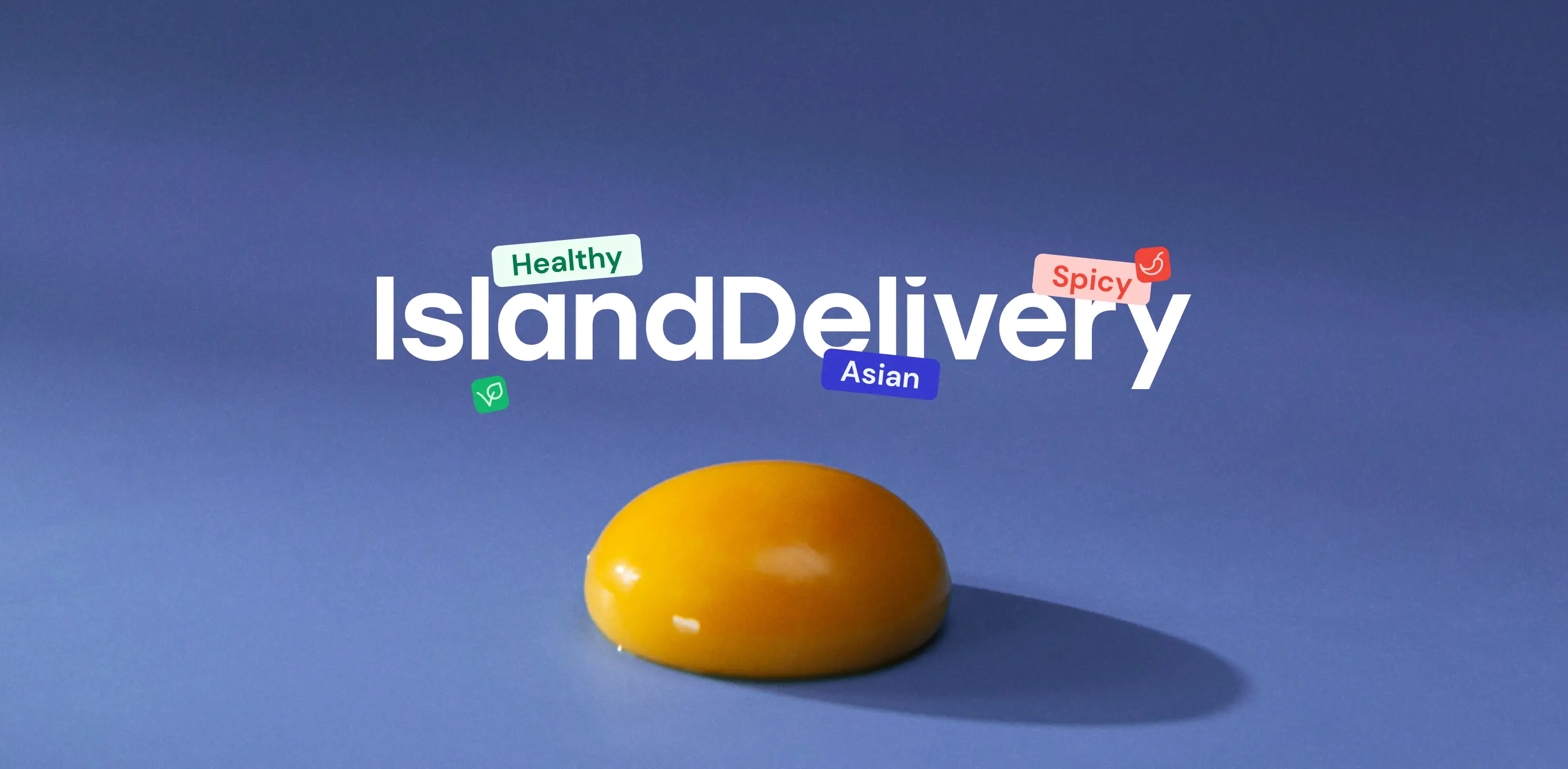 A promotional image for "IslandDelivery" featuring a glossy yellow object against a blue background. The text "IslandDelivery" is prominently displayed in white, surrounded by various colorful labels indicating food categories: "Healthy" in green, "Asian" in blue, and "Spicy" in red. The design suggests a modern, vibrant feel for a food delivery service.