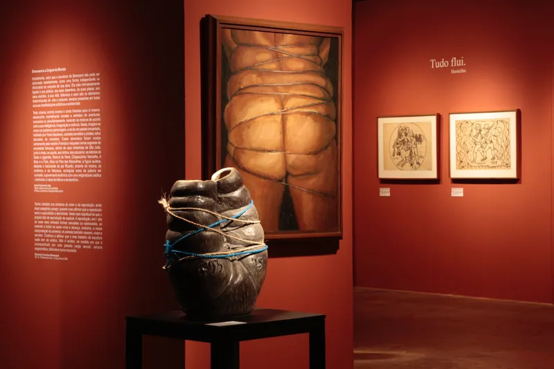A lone person explores vast desert dunes at sunset.