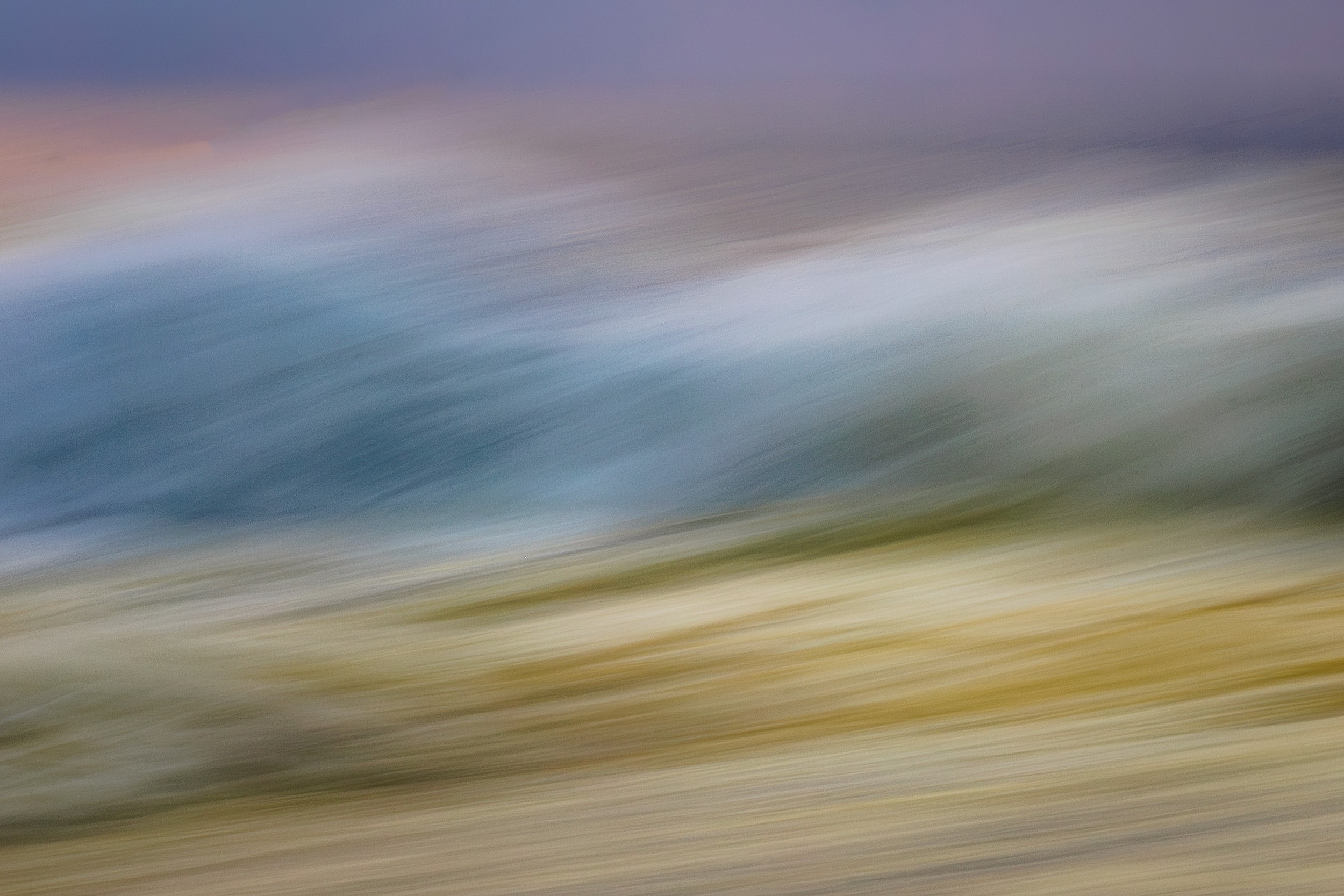 Abstract landscape with soft, blurred colors featuring shades of blue, green, and yellow, suggesting movement.