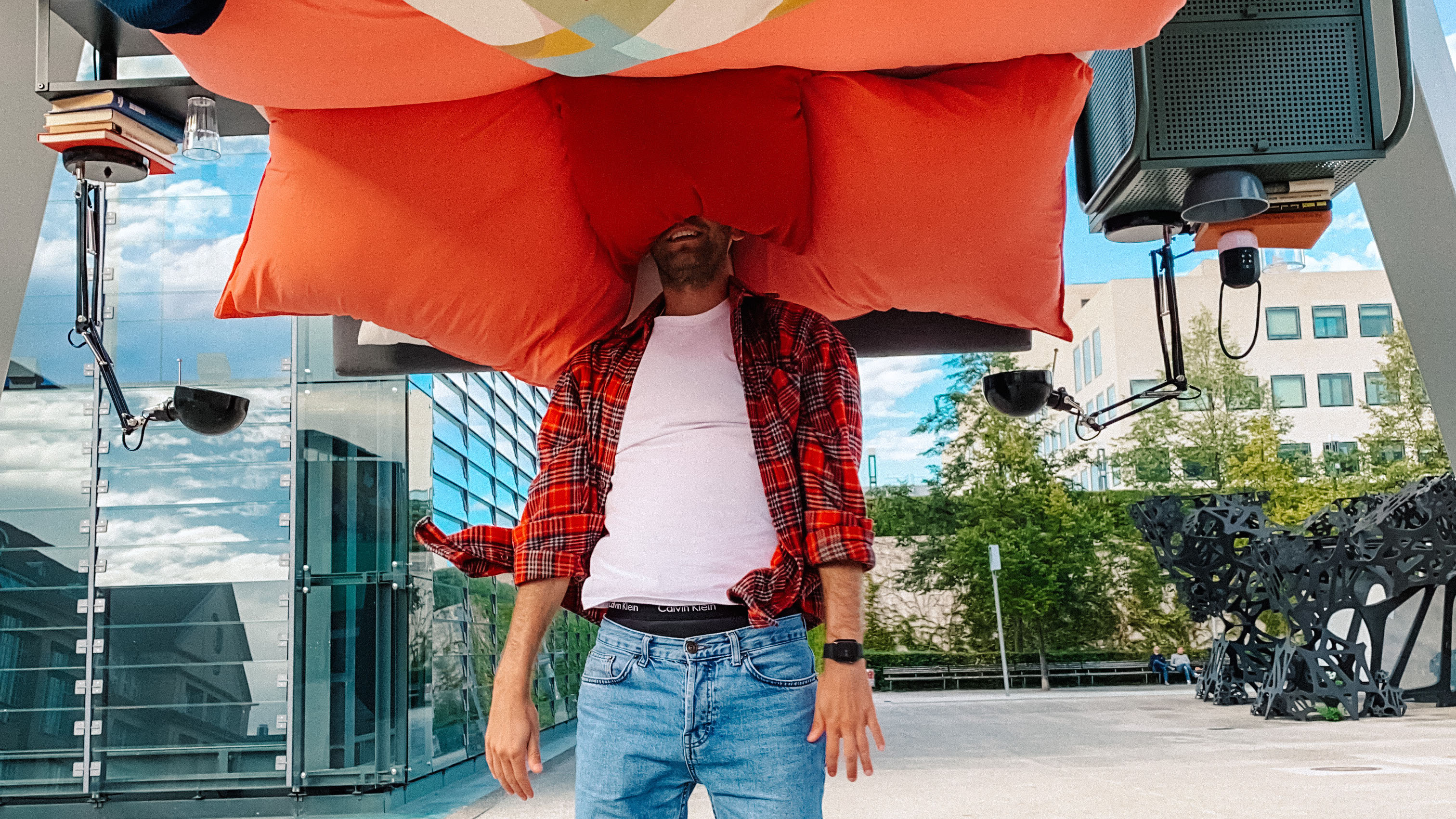 IKEA Karlsruhe net huddle campaign activation with a participant jumping into an upside-down bedroom installation inside a large public pyramid structure.