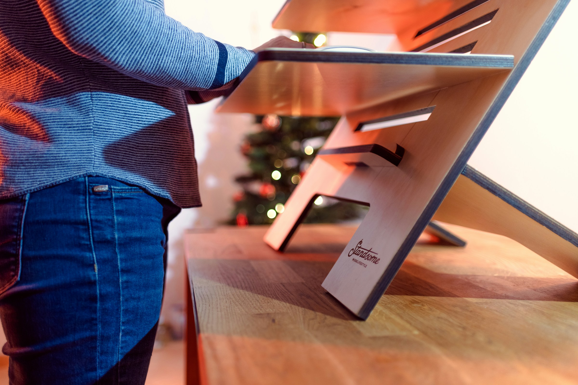 person on standing desk - Posture Correction Device