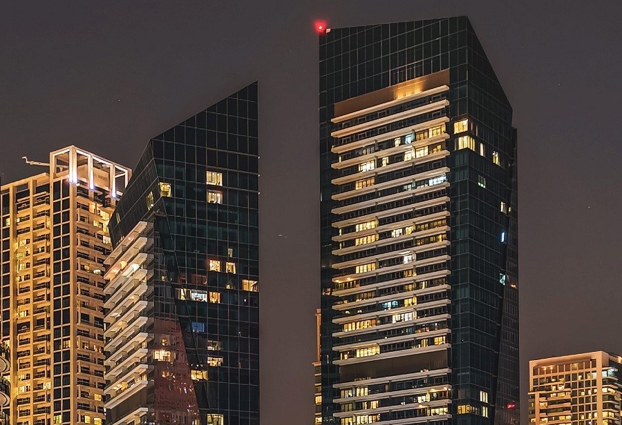 Luxury waterfront apartments at Silverene Tower Dubai Marina glowing at night.