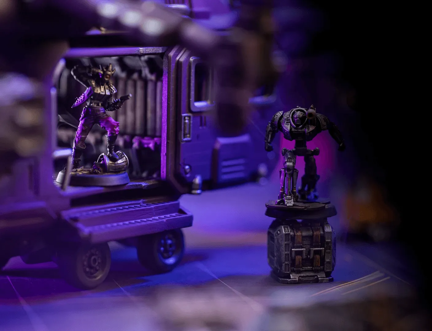A person fingers reaching out to a miniature of an Troll