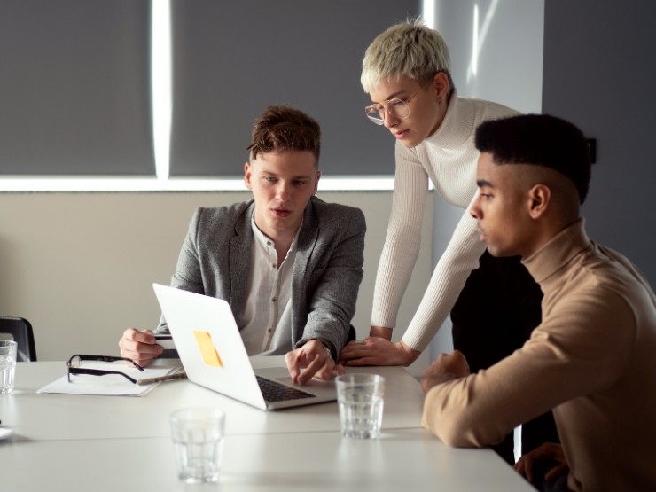 Business professionals using fractional support services in a modern UK workplace
