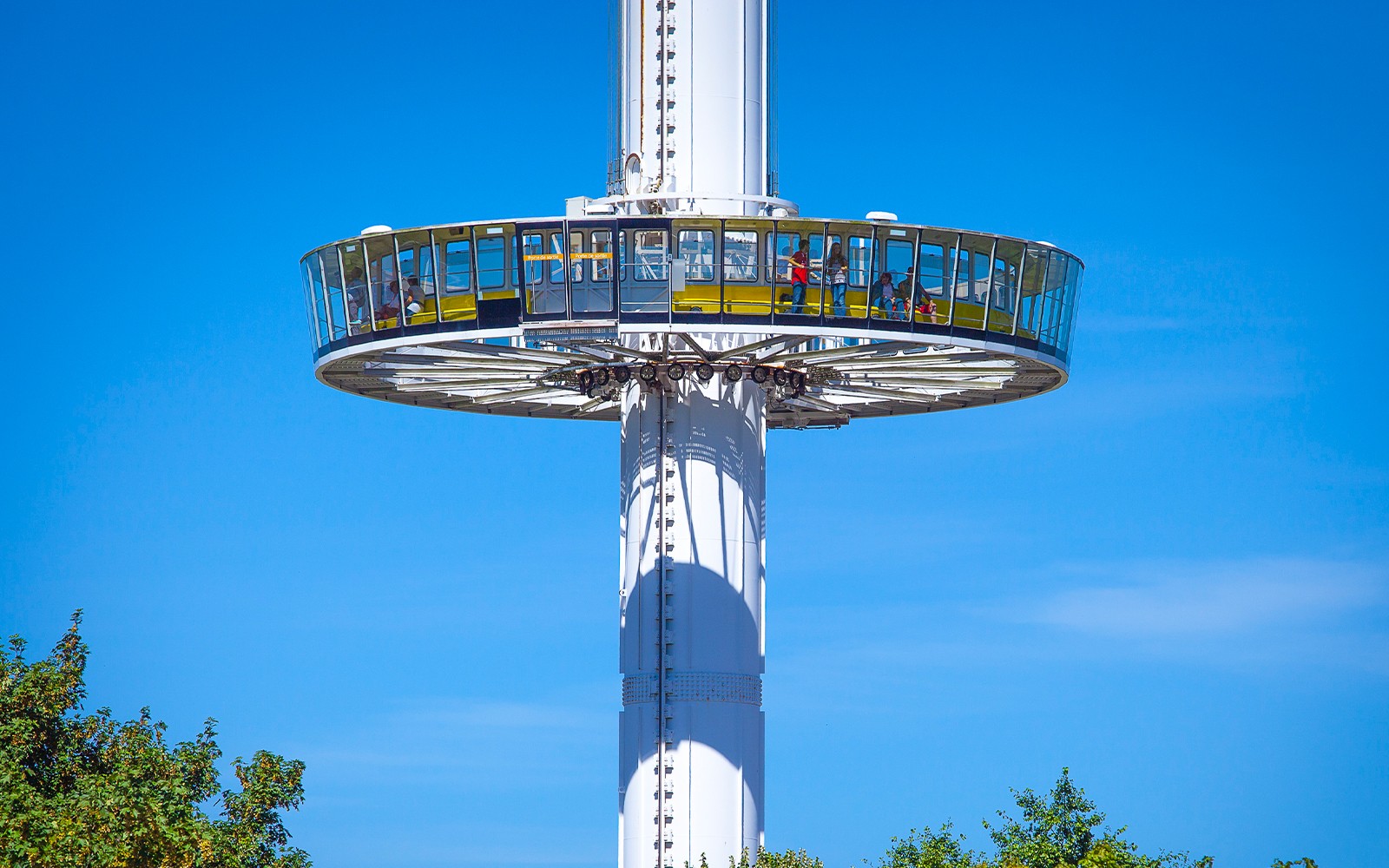 Gyrotour ride at Futuroscope, France, with passengers enjoying panoramic views.