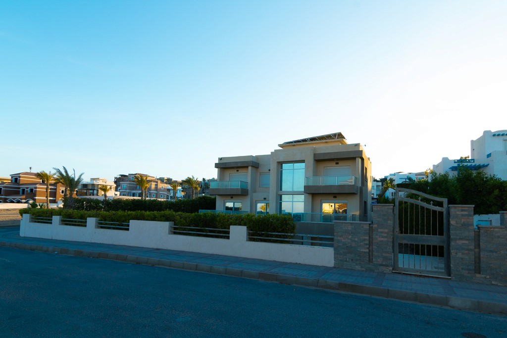 white and brown concrete building under blue sky during daytime
