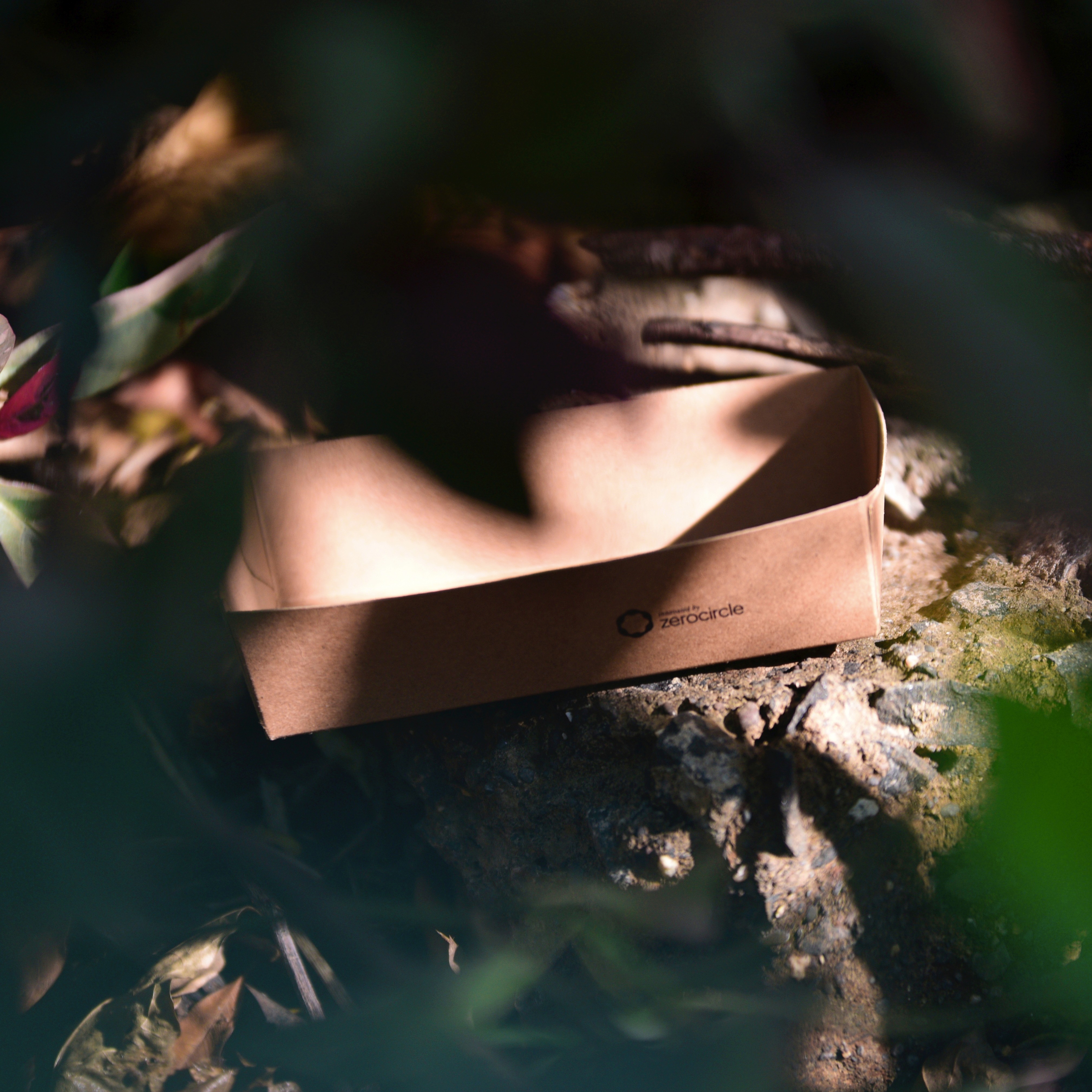 Farm fields with barn and mountains in background