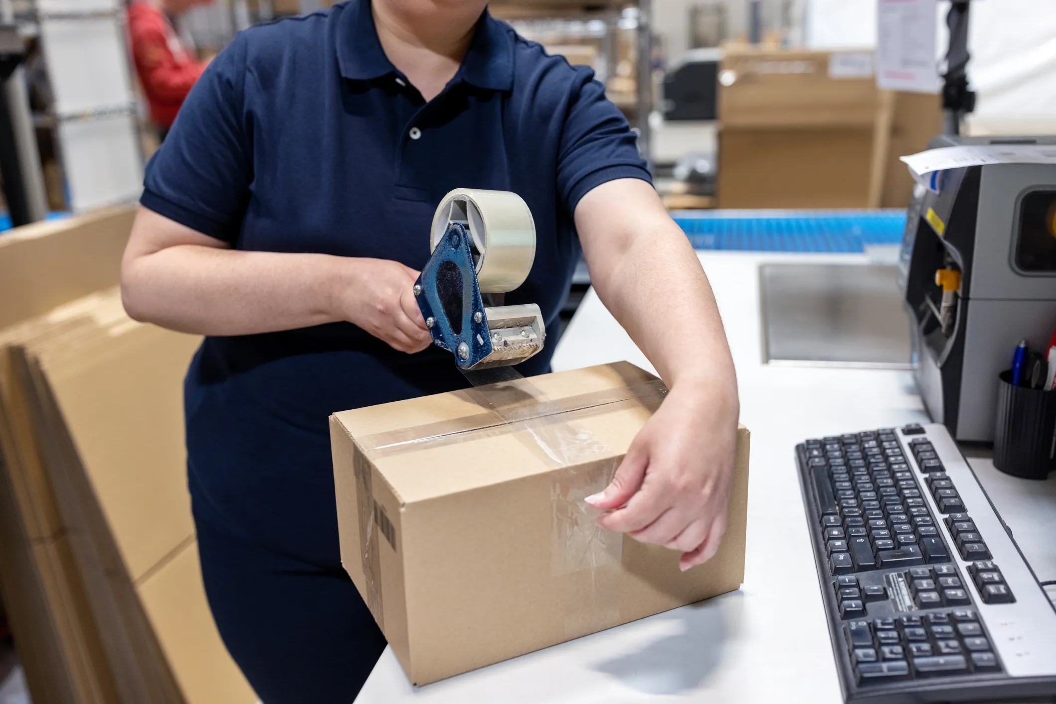 man handing a box and checklist