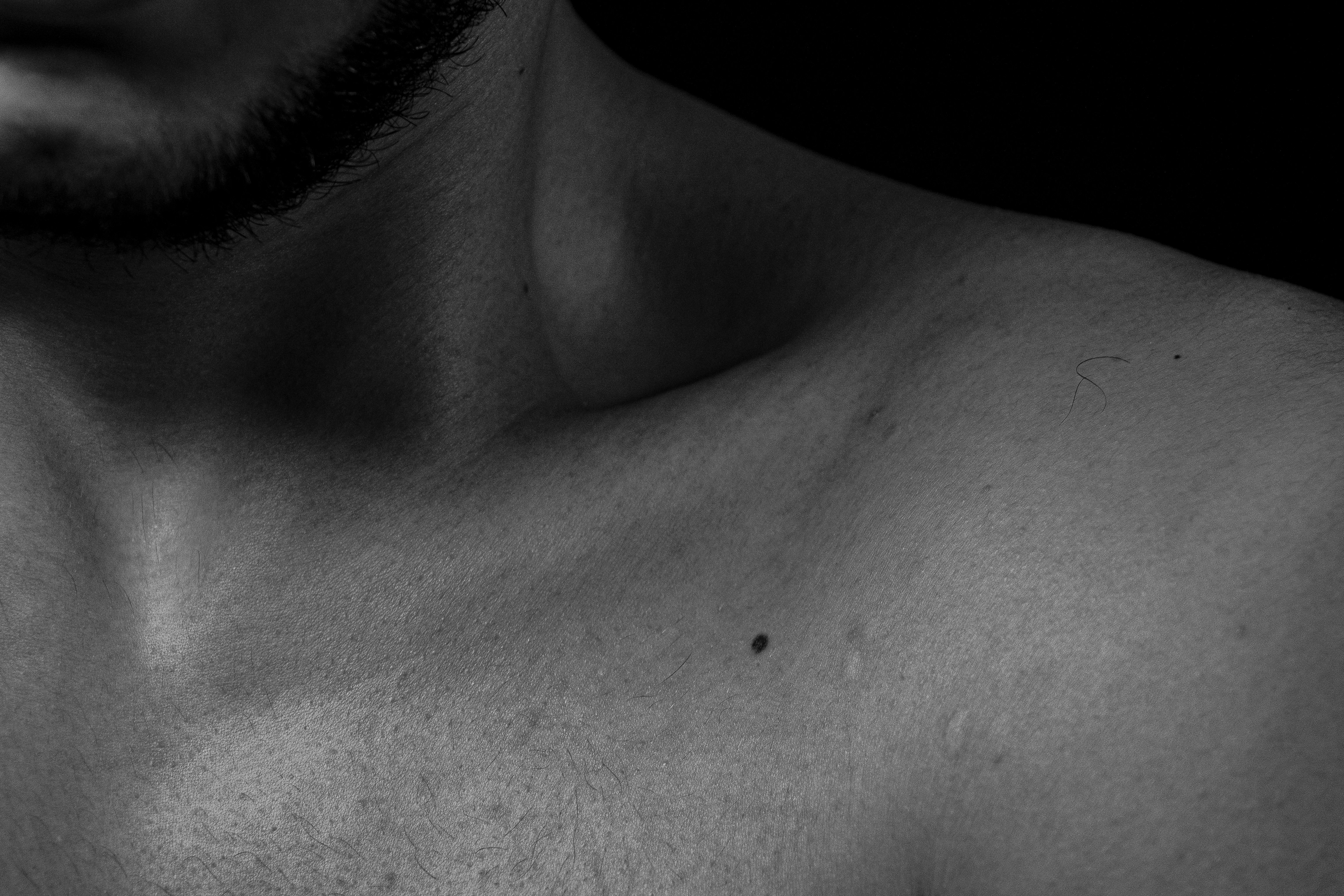 a close up of a shirtless man's chest