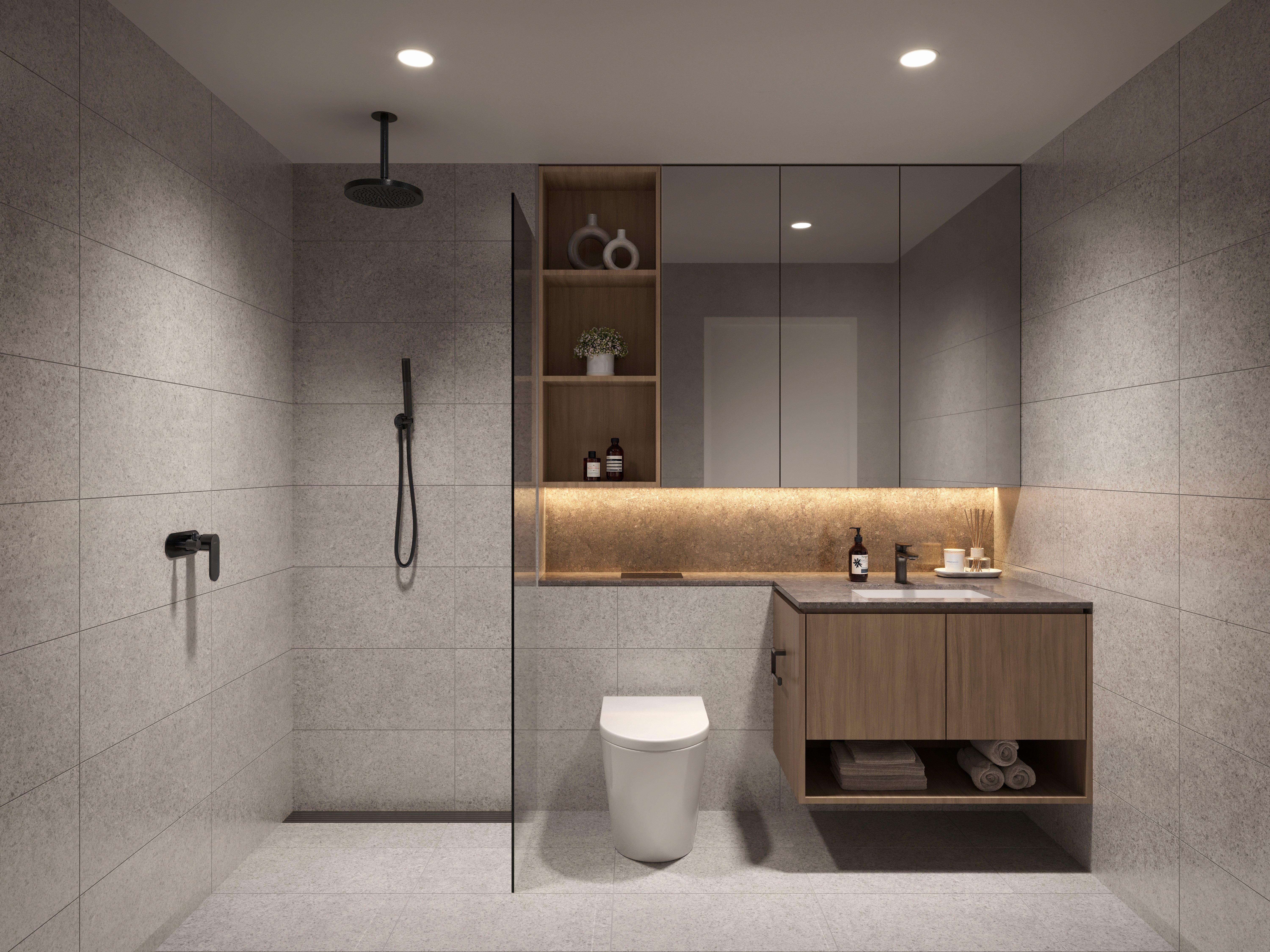 Stylish bathroom with walk-in shower, timber vanity and warm lighting at Blossom Carlingford apartments Sydney.