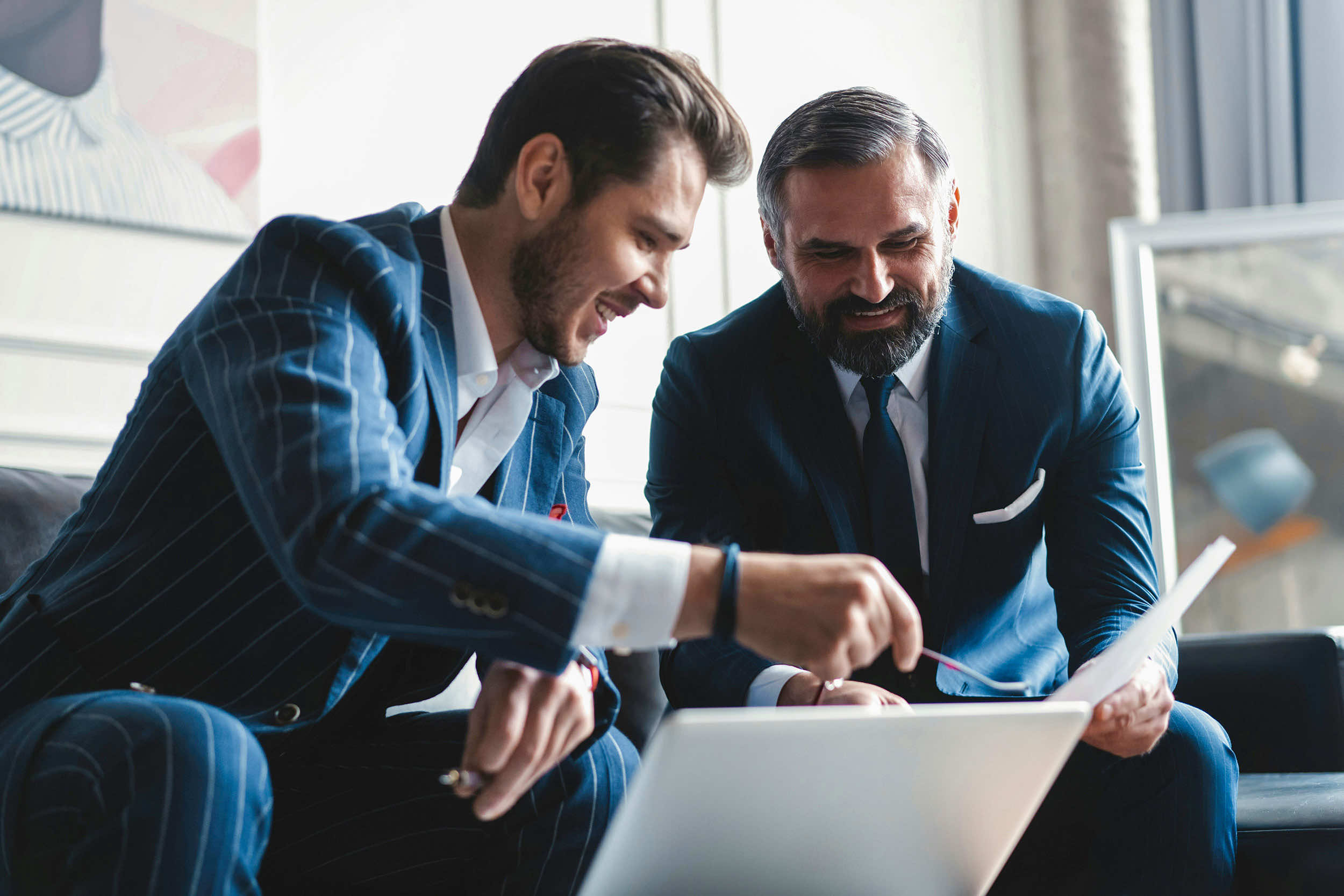 side-view-businessmen-checking-document