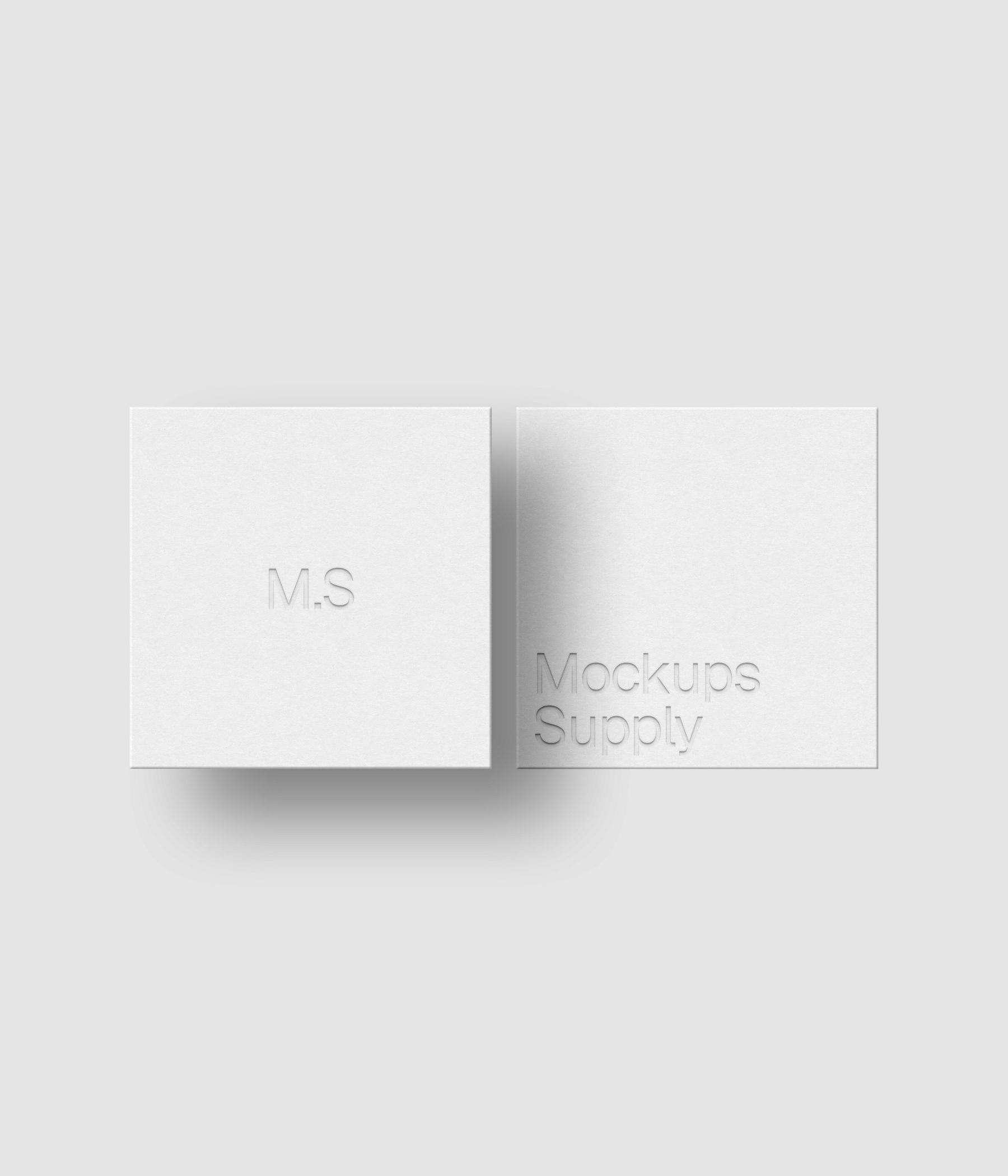 2 square business cards mockup in a row for Photoshop with shadow and debossed text effect, white cards on white background, minimal branding and stationery presentation