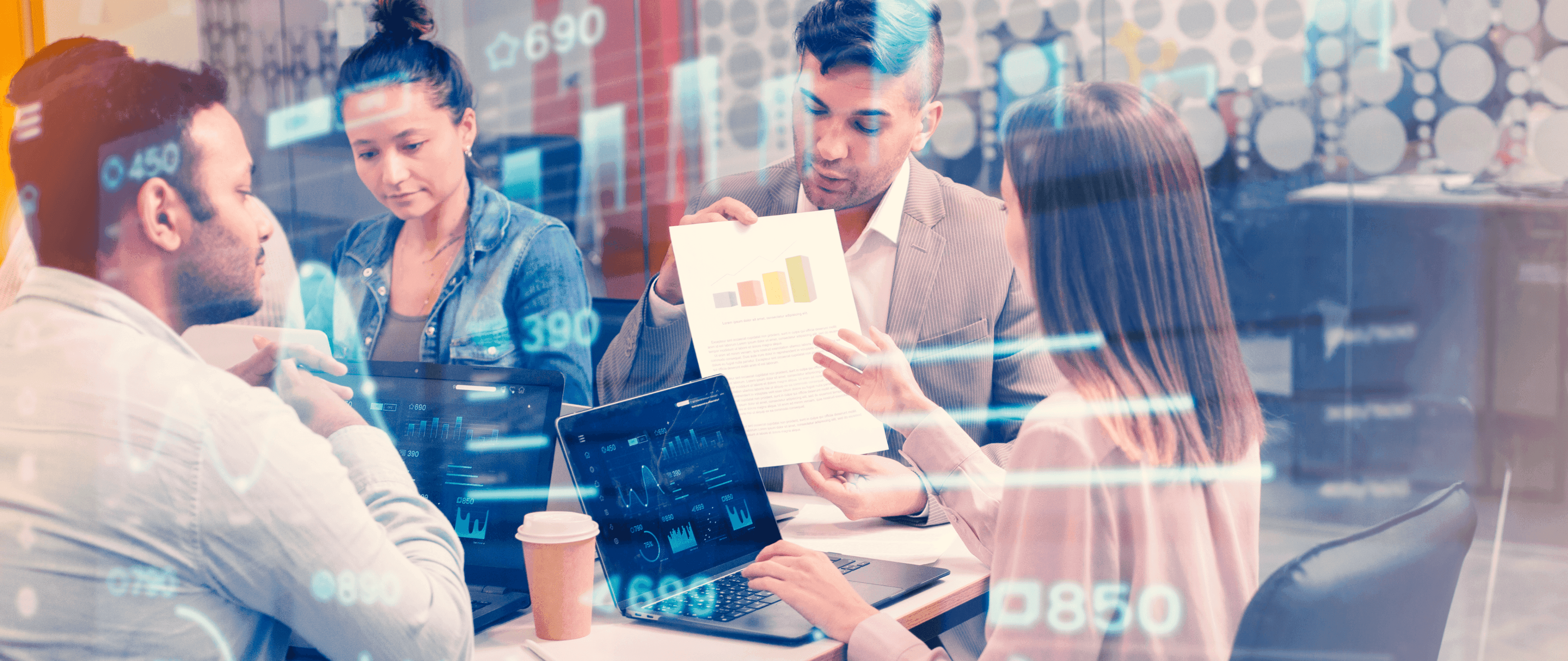 Team reviewing charts and digital risk dashboards together, illustrating how sanctions screening self-assessments help align firm processes and screening software for effective compliance.