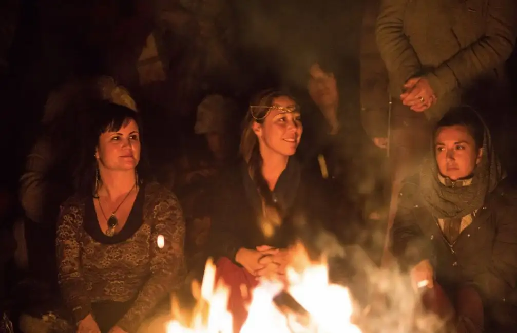 women around a campfire 