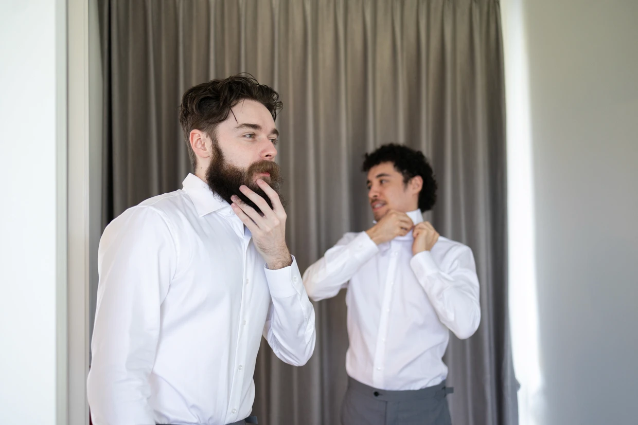 Groomsmen adjusting their suits
