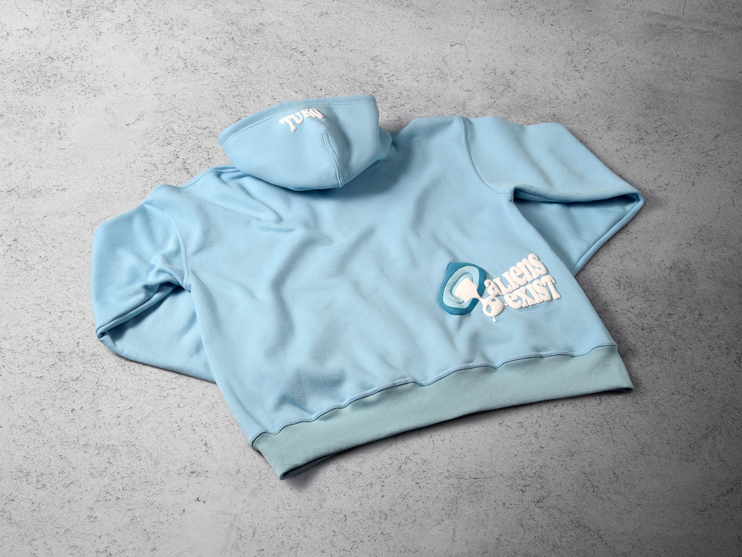 Tuko Clothing blue Dandadan inspired hoodie photographer by Matthew Brown (London product photographer).