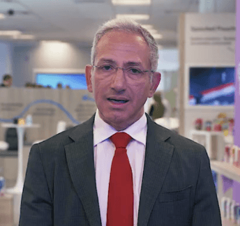 man in white crew neck shirt wearing black framed eyeglasses