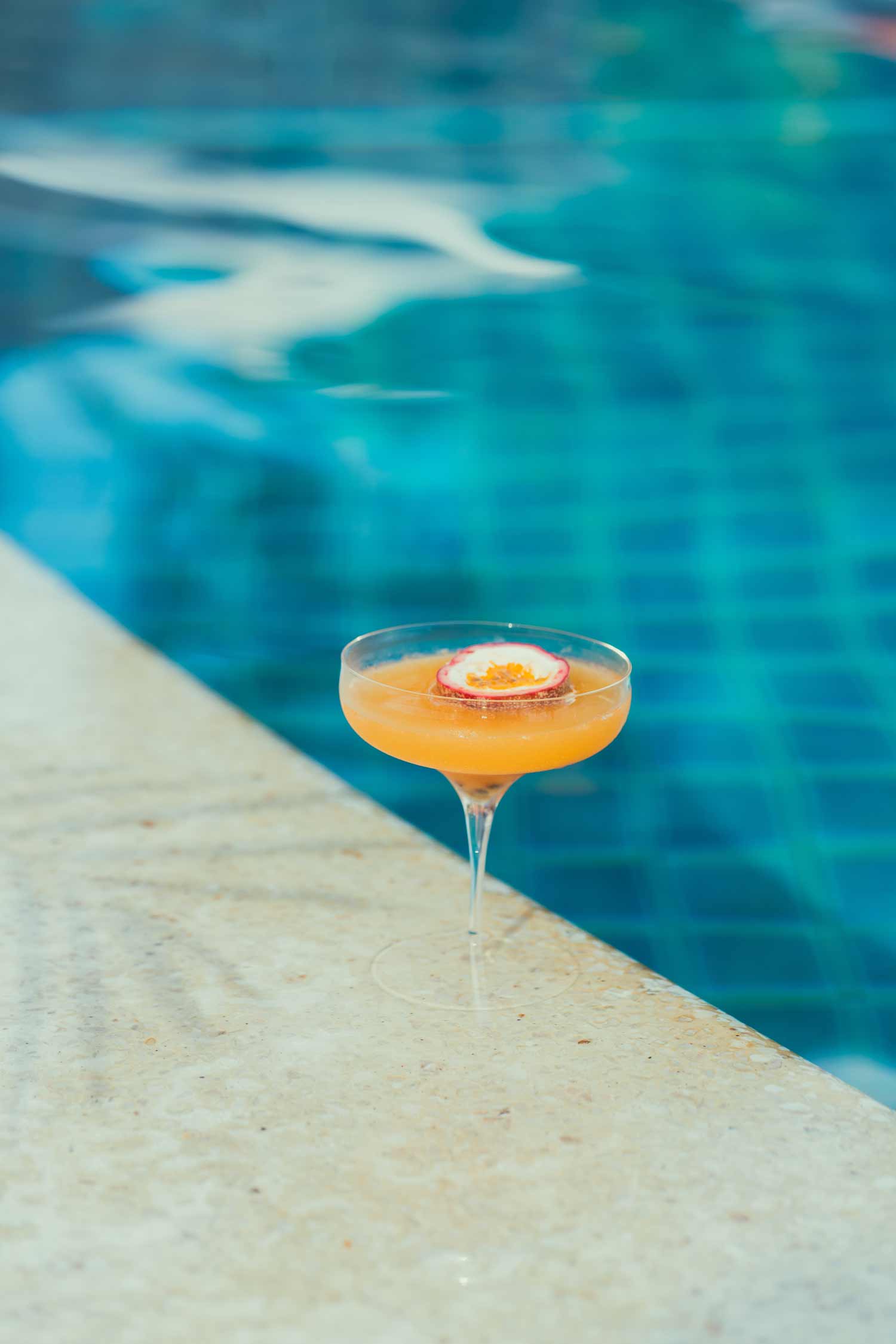 Elegant cocktail beside pool, perfect for filmproduction ad for a hotel in mauritius