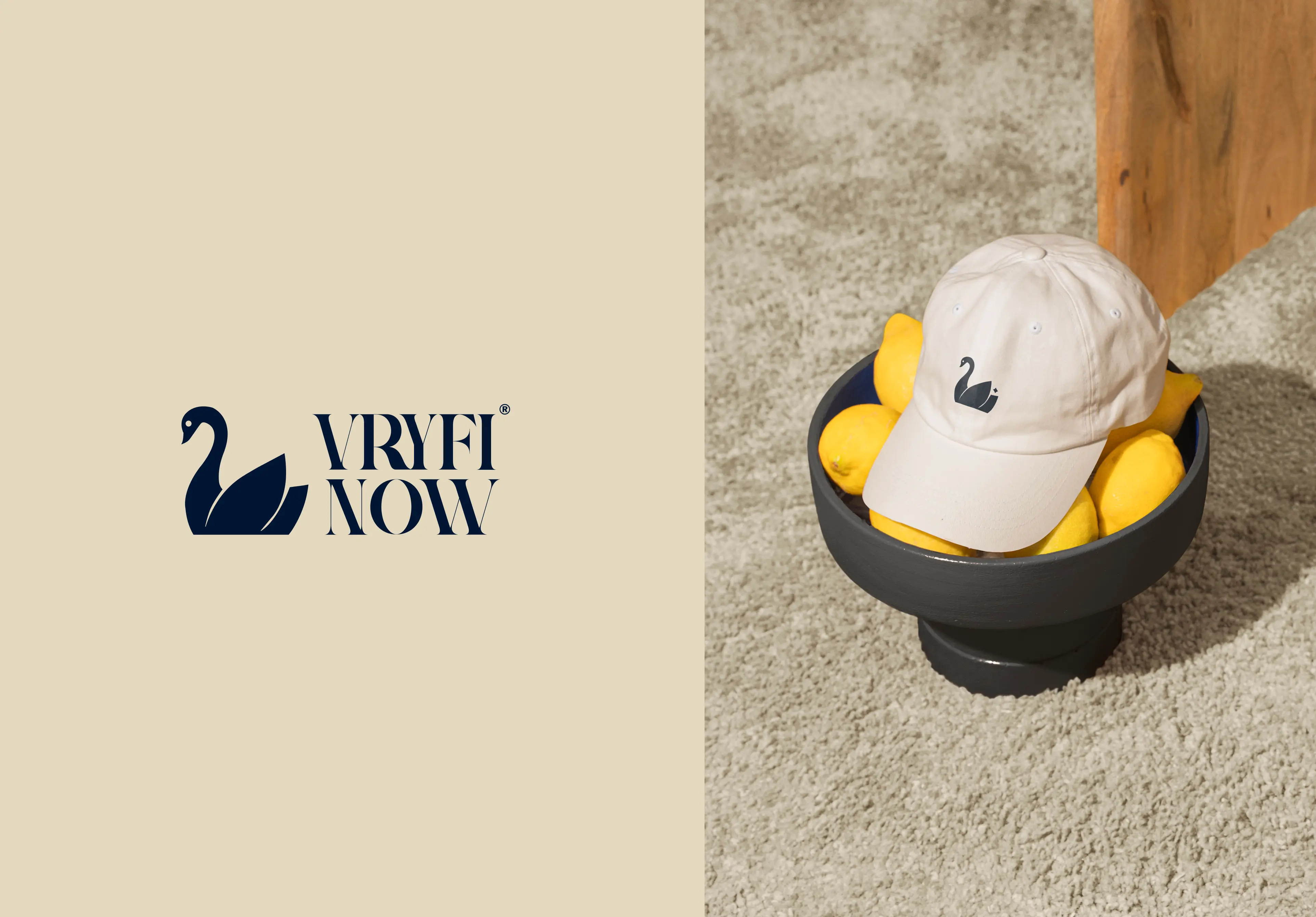 VRYFI NOW branded merchandise showing logo lockup alongside a navy branded cap with lifestyle styling
