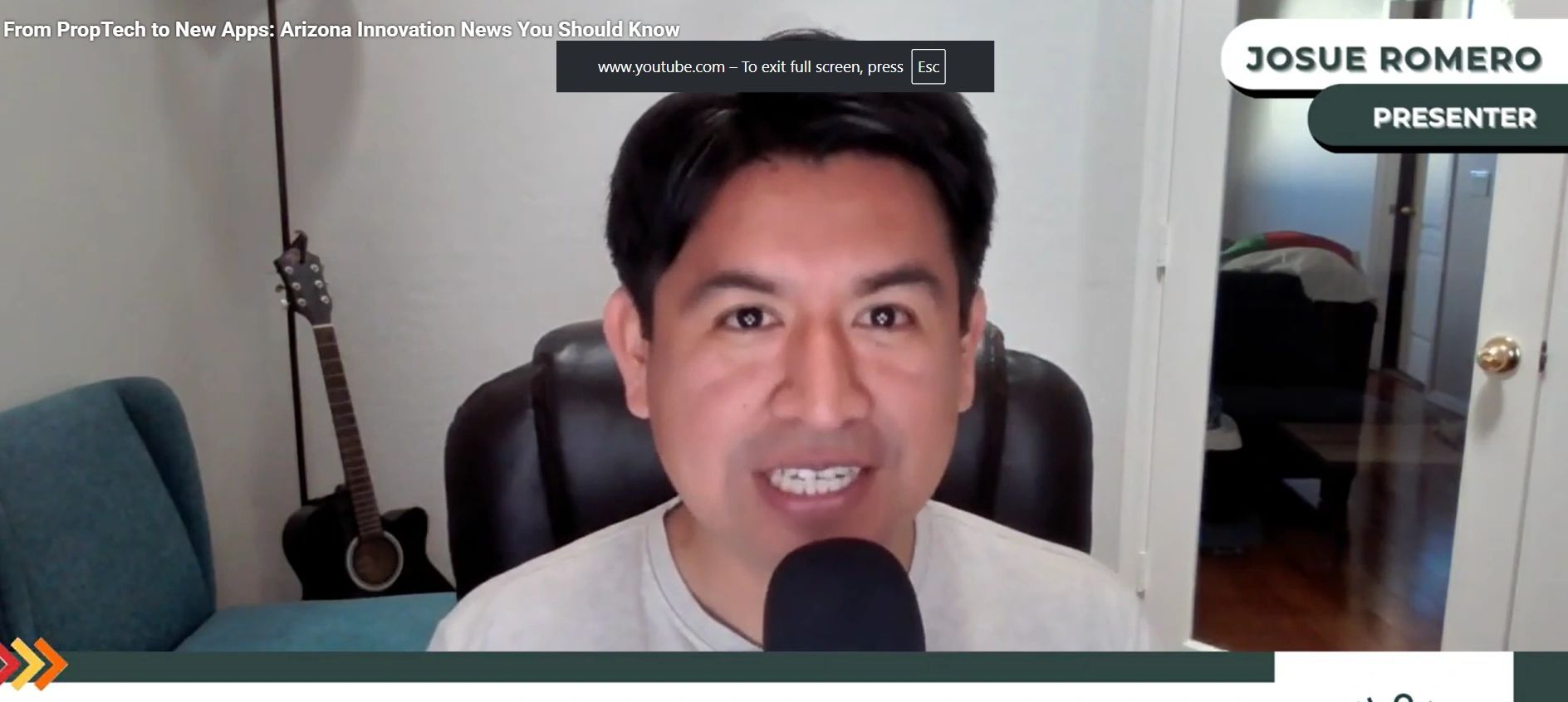 a black and white living room with a large tv