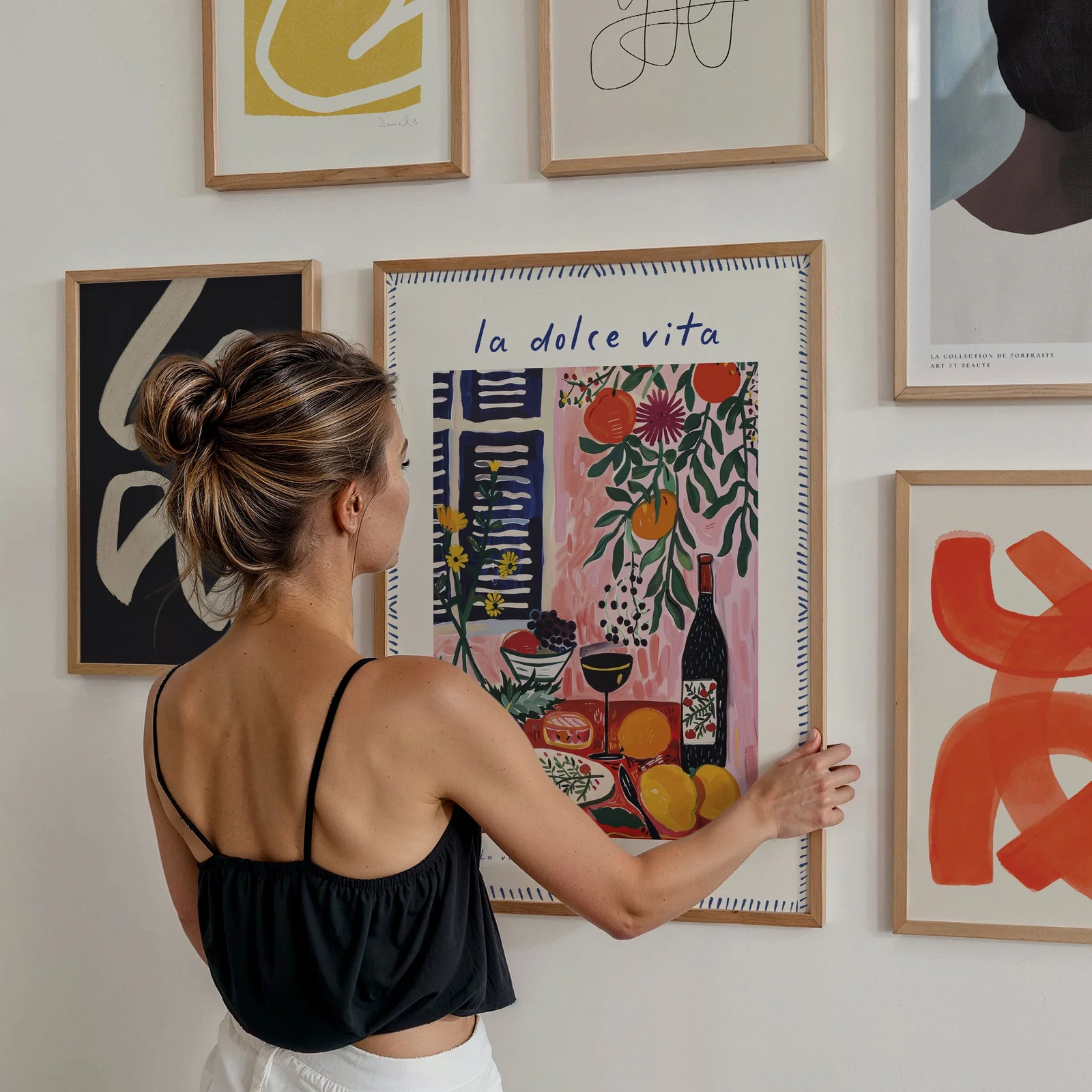 man in white and black crew neck t-shirt and blue denim jeans
