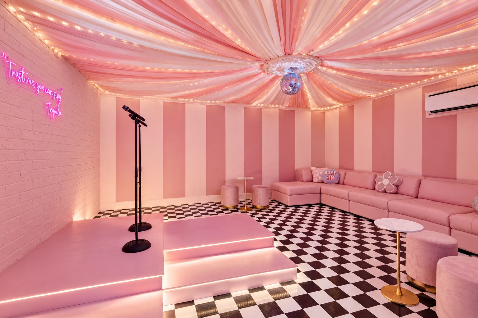 Pink karaoke stage with a microphone stand and checkerboard dance floor