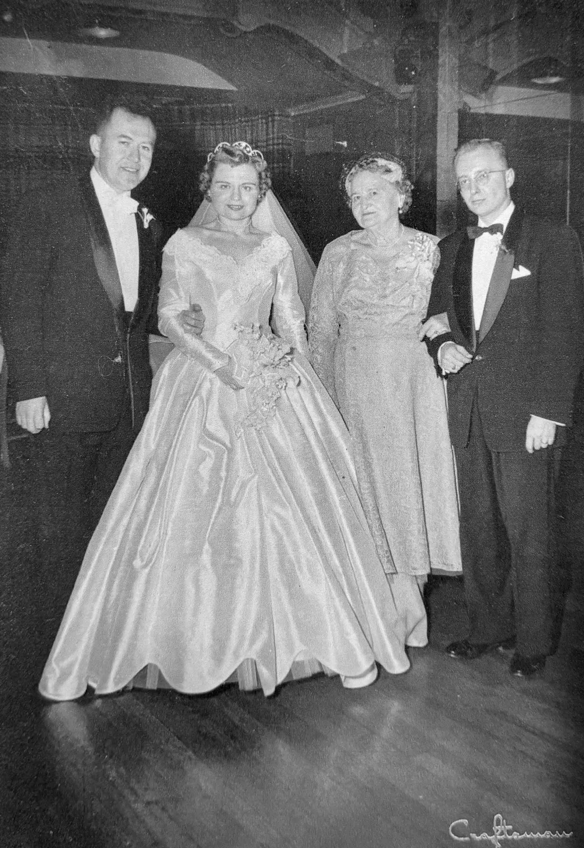Black and white image of old family photo ofgrandparents on their wedding day.