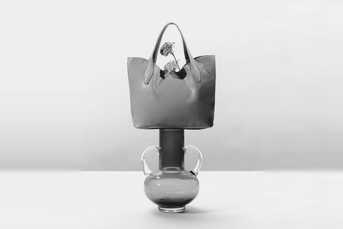 A MISAKO tote bag balanced on a glass vase