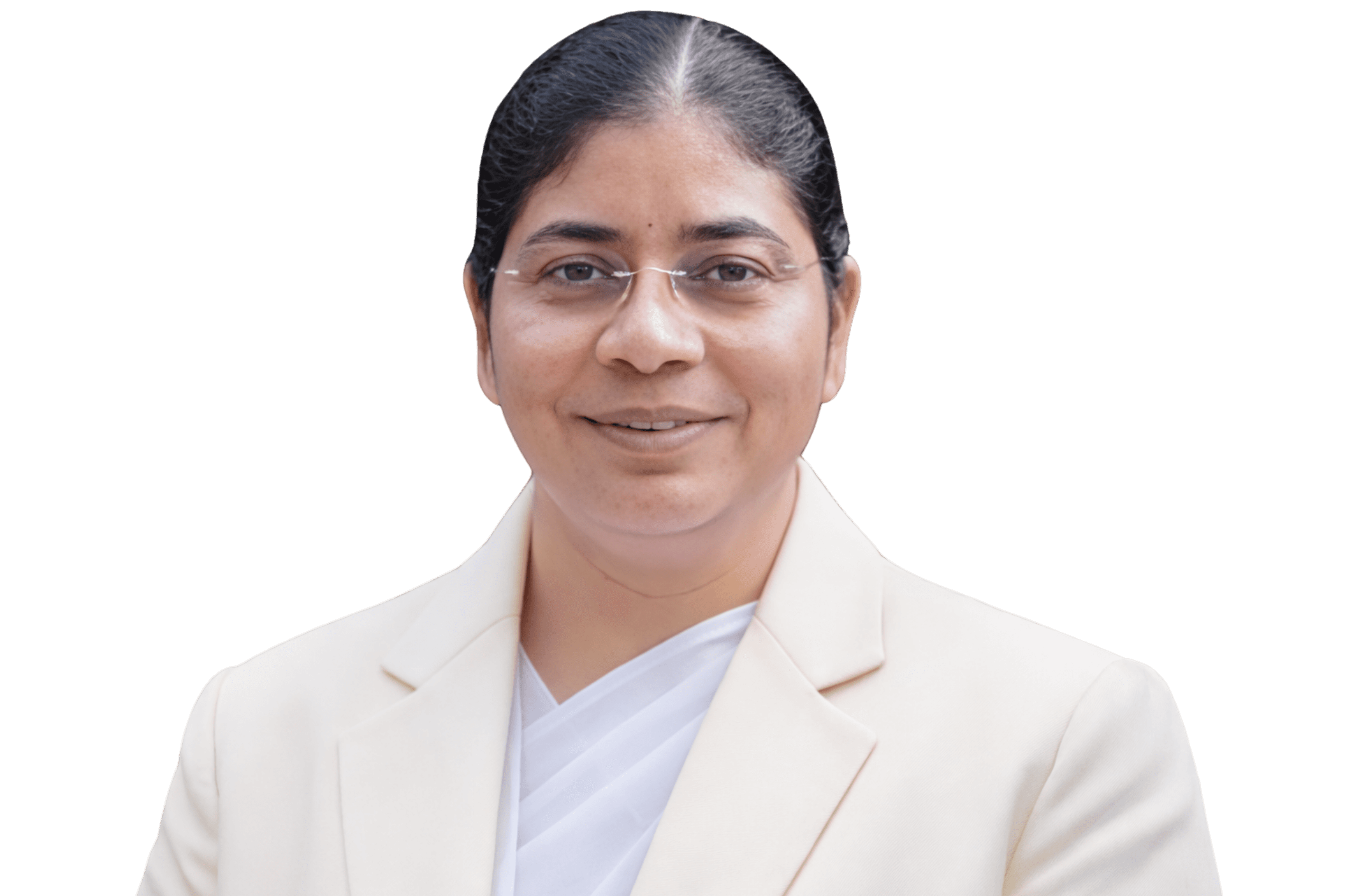 Smiling female therapist with short gray hair, wearing a brown top and a purple shawl, surrounded by a cozy background.
