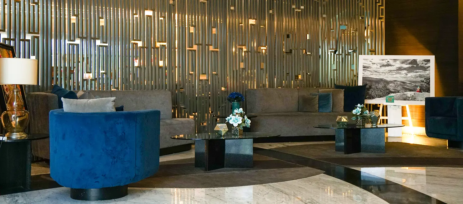 A vintage-style hotel suite with classic furnishings and elegant decor.