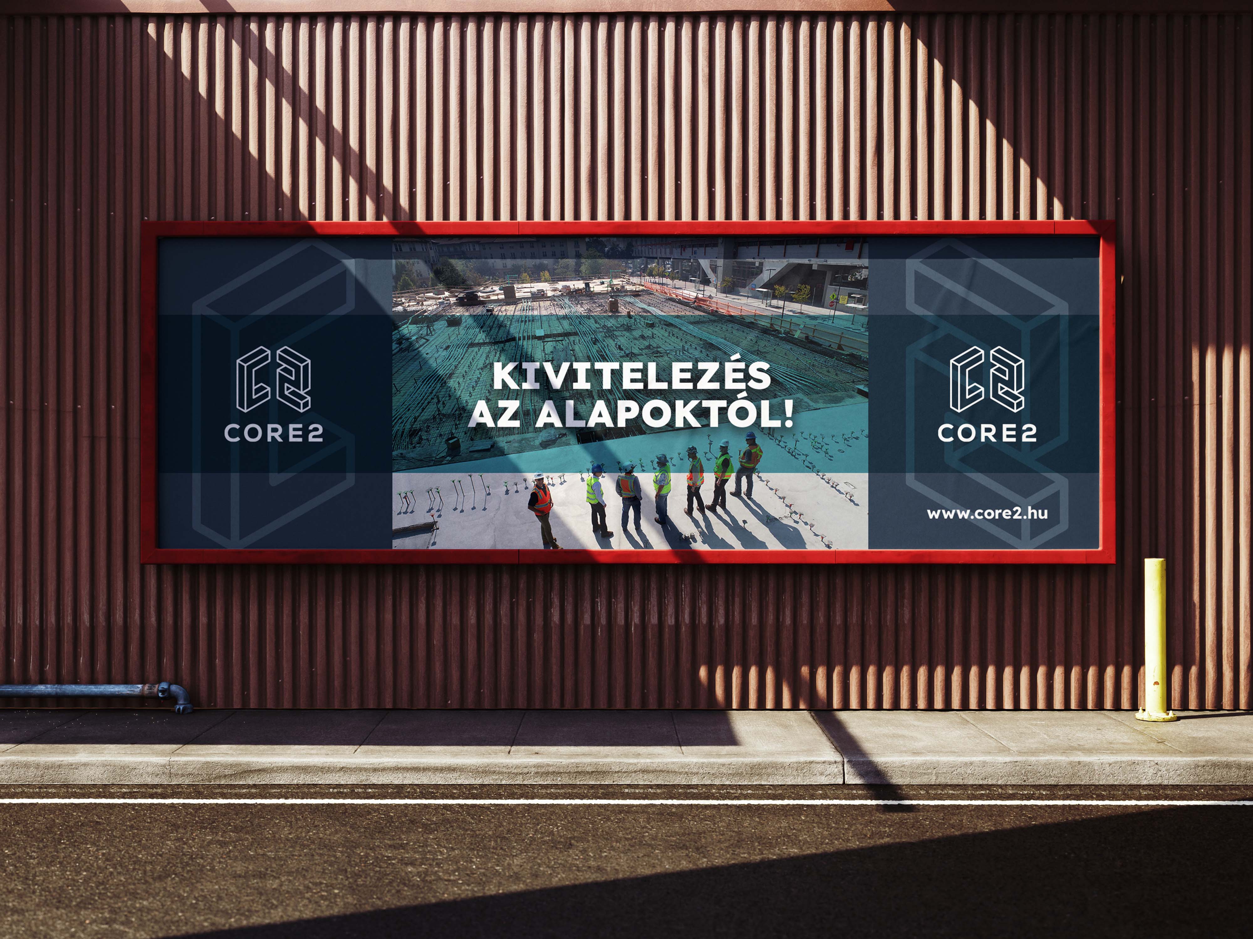 Outdoor billboard with construction site photo and branding - Core2, a property development brand identity.