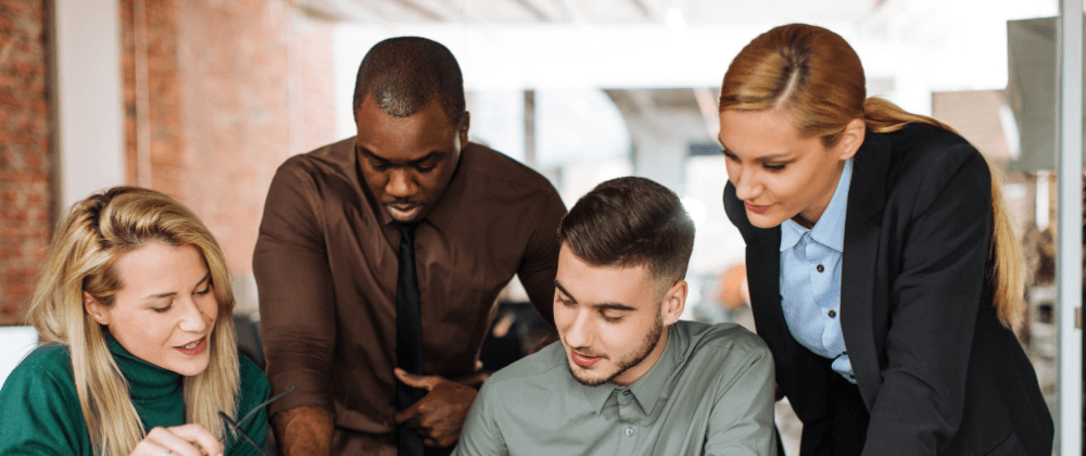Four colleagues looking at a map