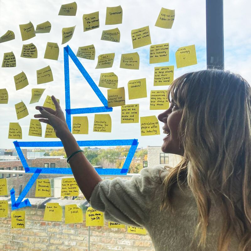 Angela Parker facilitating a sailboat exercise during a workshop