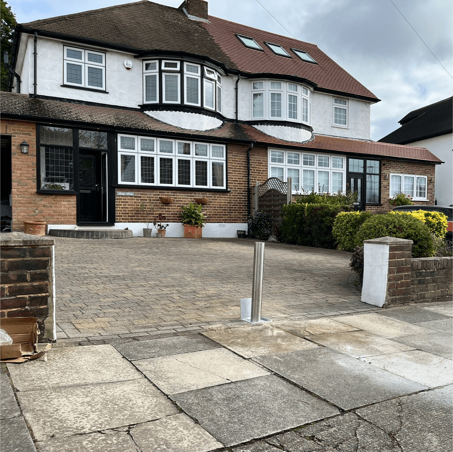 Telescopic bollard on driveway