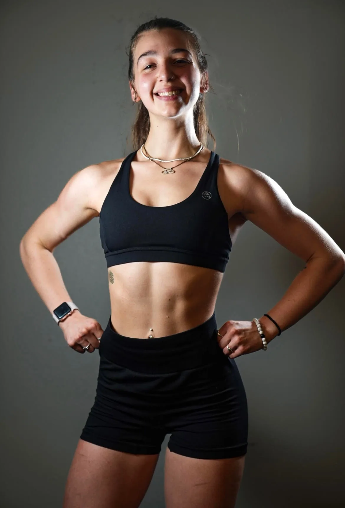 Alyssa, trainer at Big Tex Gym, standing confidently in athletic wear