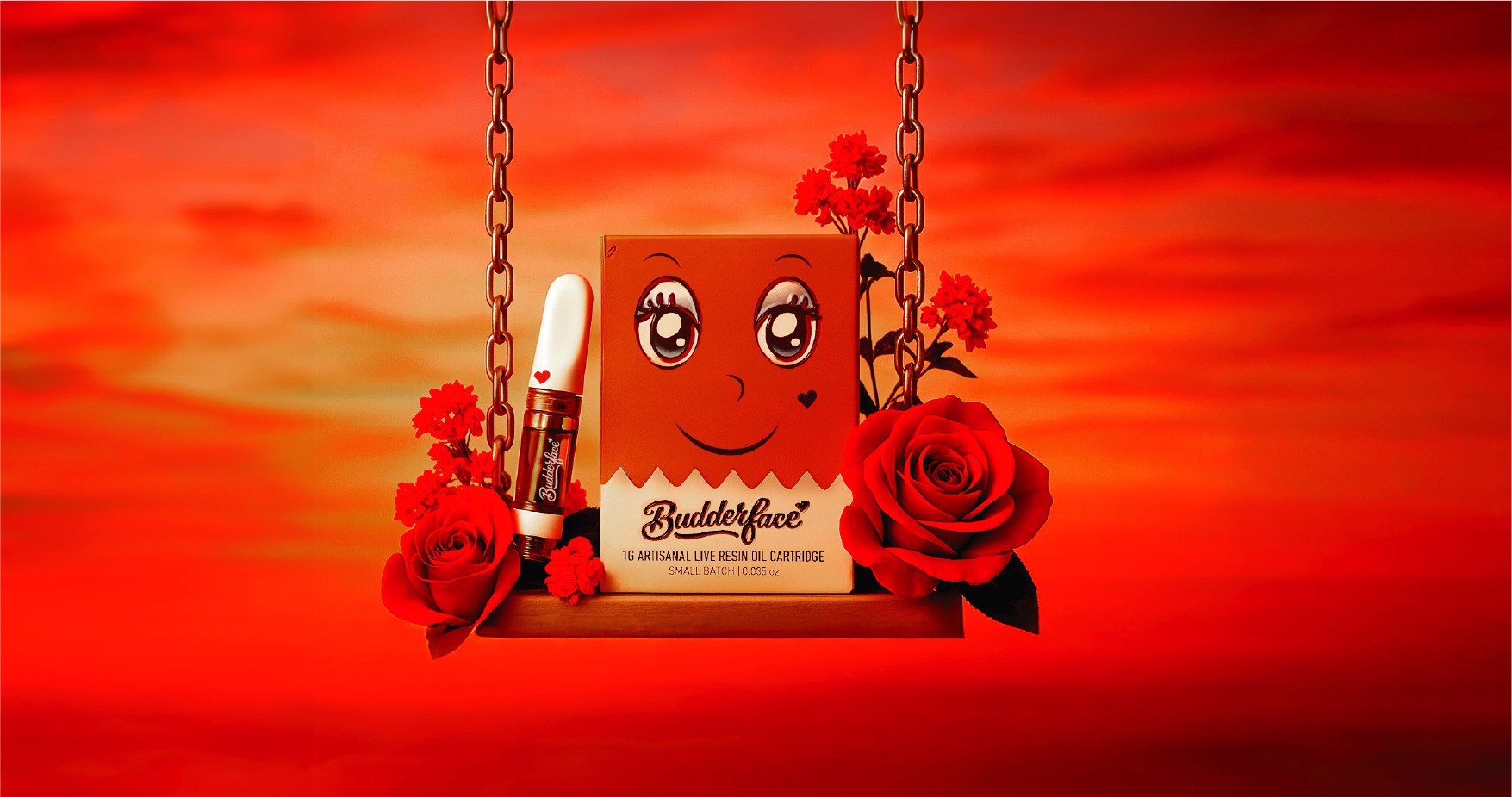 Box of Budderface live oil resin cartridges on a swing surrounded with roses