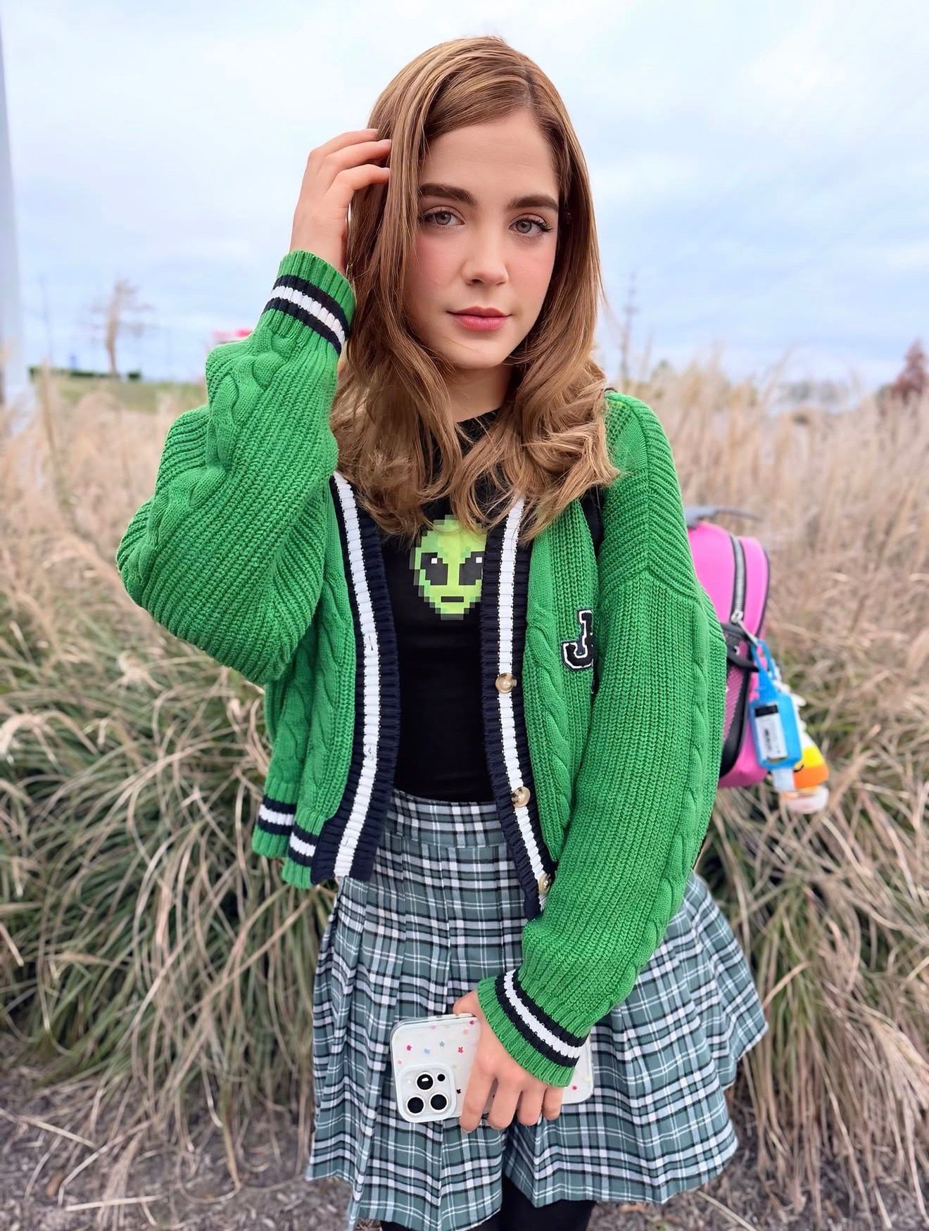 man standing near white wall