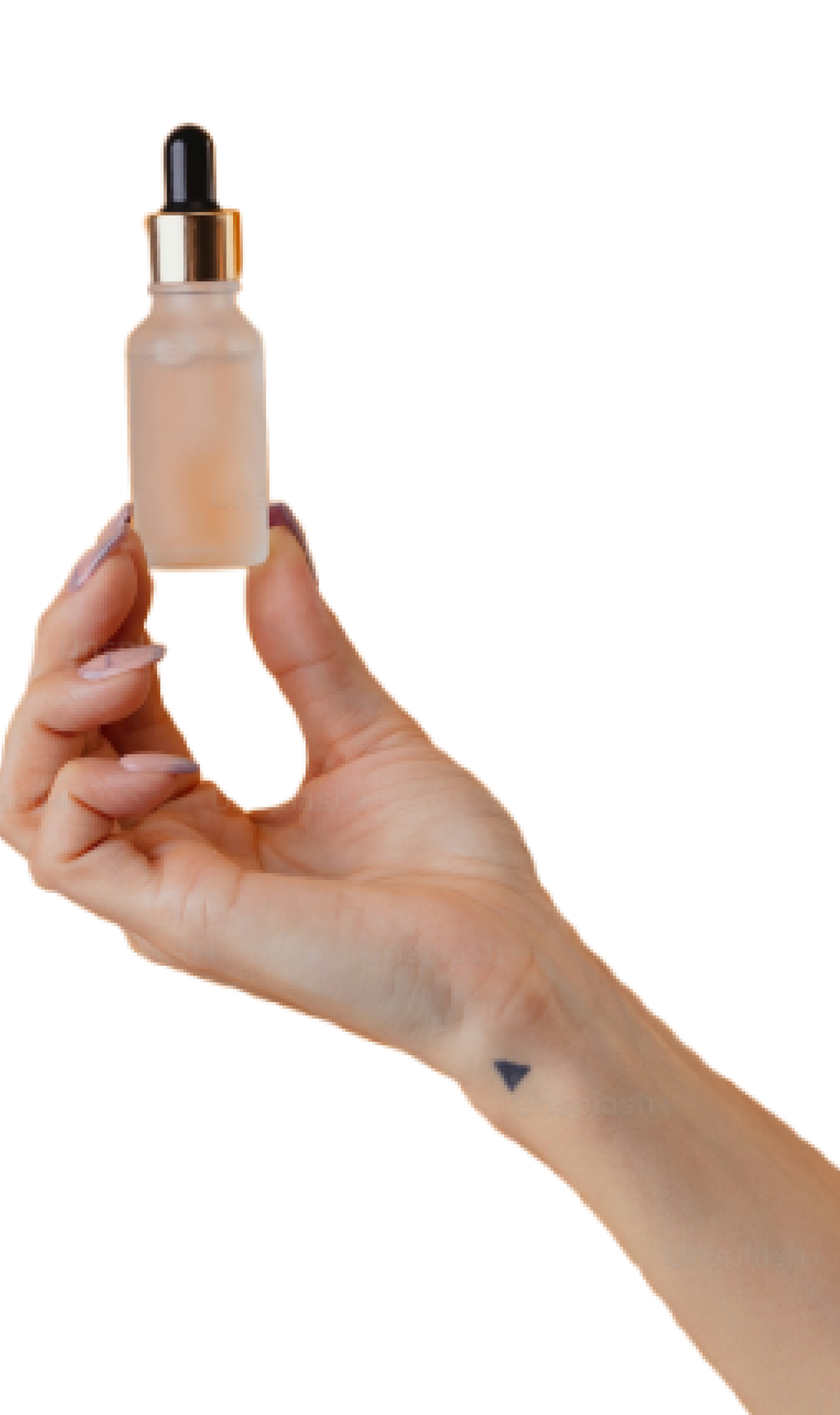 A hand with a small triangle tattoo on the wrist holds up a frosted glass dropper bottle filled with a clear liquid against a plain background.
