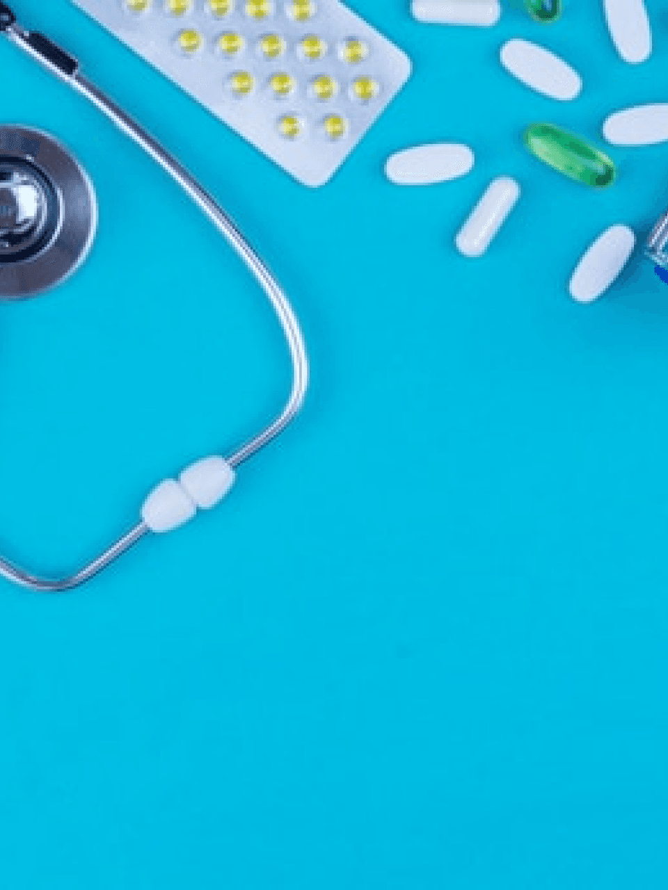 Scatterd pills and a stethoscope